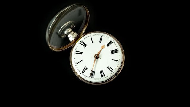 Running second hand on an old pocket watch with a white dial. Close up. Timelapse . Back background