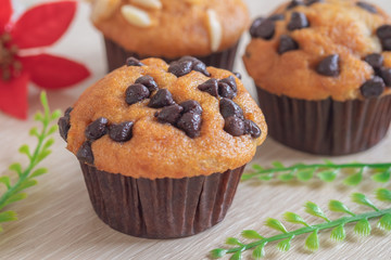 Muffin with chocolate chips on table.