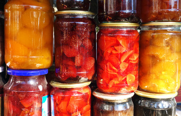 Fototapeta na wymiar Jars of tasty jam on market. Homemade sale
