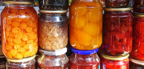 Jars of tasty jam on market. Homemade sale