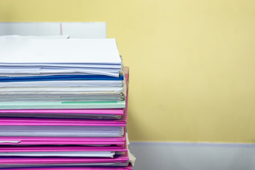 Stack of accounting documents on desk