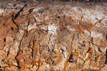Corrosion of the protective surface of the underground utilities
