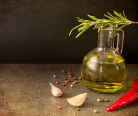 bottle of olive oil and olives on white background