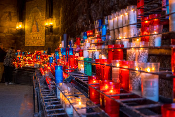 Candles in Montserrat monastery on mountain in Barcelona, Catalonia.