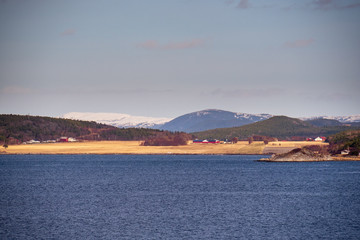 Norway landscape view with ice and snow during winter with a stunning colored sky