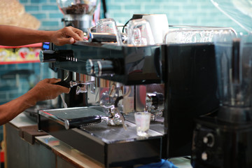 barista operate coffee maker machine