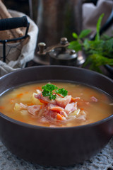 Pea soup with smoked chicken, selective focus
