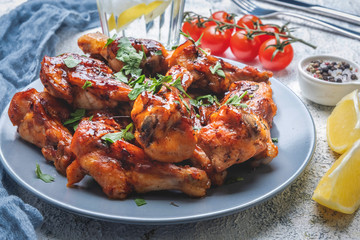 tasty baked chicken pieces in teriyaki sauce, closeup