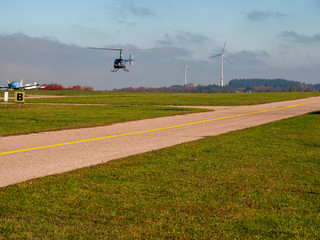 Fototapeta na wymiar Helicopter landing at airfield 