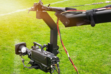 Event video camera on crane live football mach or concert.