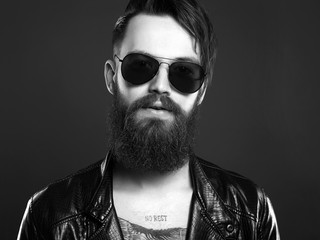 fashionable handsome man in sunglasses. Hipster