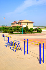 Fitness equipment in a village sports arena, China.