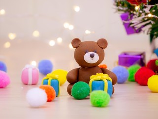 Christmas Carnival of the Blessed and the adornment of the lights at the tree, toys gift boxes and bear dolls