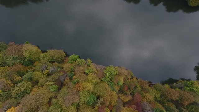 Drone flight over a hidden Parz lake in the Armenian autumn forests