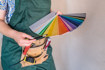 Macro on female hands with colour swatch