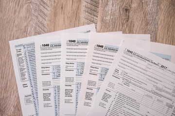 Naklejka premium Blanks of individual tax form on wooden table