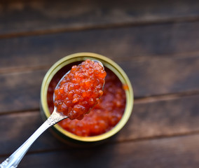 red caviar in a dessert spoon