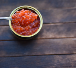 red caviar in a dessert spoon