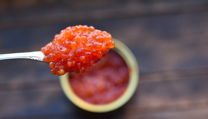 red caviar in a dessert spoon