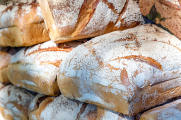 Assortment of different types of breads for sale on the market.