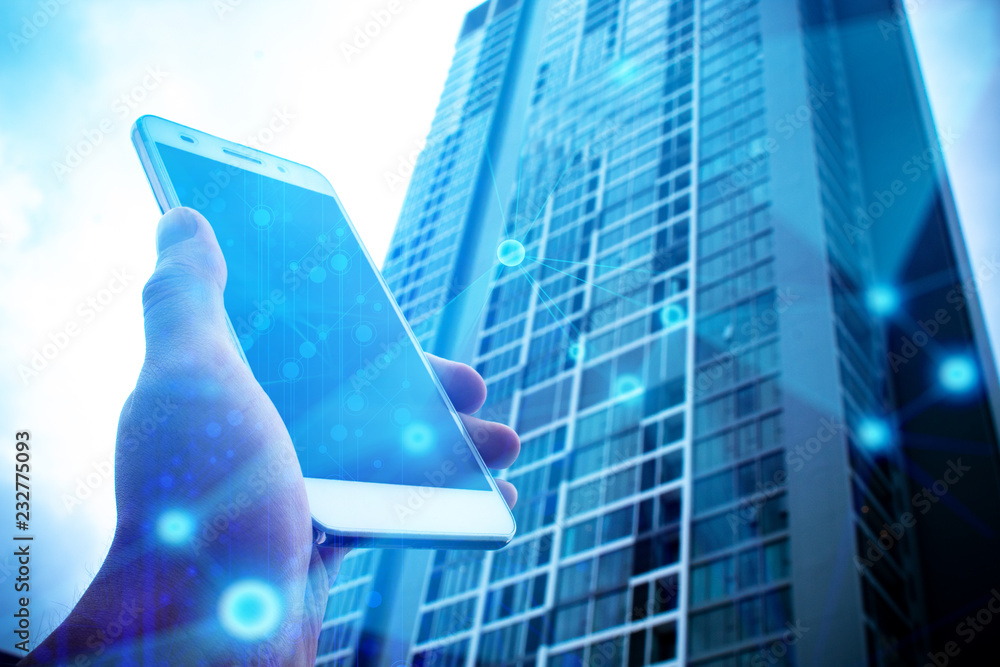 Poster hand with phone mobile and building in network background with business concept