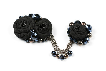 Handicraft brooch and pendant in the form of black flowers from fabric, connected by a chain