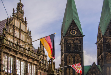 Fototapeta na wymiar Bremen, Germany. View of the city hall and the Cathedral. On the town hall flags of Germany and the city of Bremen are installed.