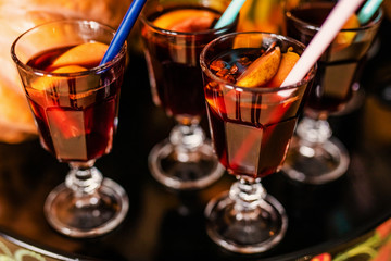 Mulled wine with cinnamon and oranges for the celebration of Halloween