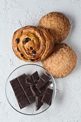 chocolate and pastries on white rustic background