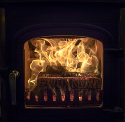 Raging fire in log burning stove