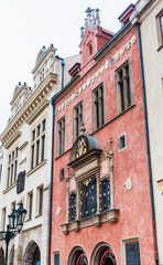 Obraz premium Old windows in Prague, with Gothic Style, in the old town during the day, with paint and a lot of stylistic details around, Czech Republic