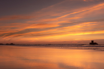 Gorgeous reflections at sunset on St Ouens Bay beach, Jersey, Channel Islands