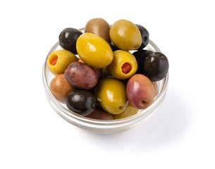 kalamata and conservolia olives in a white bowl isolated against a white