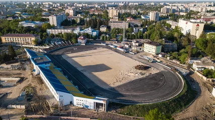 Fotobehang Aerial view of the football stadium during construction © Oleksii Nykonchuk
