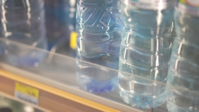 Close up plastic water bottle in refrigerator 
