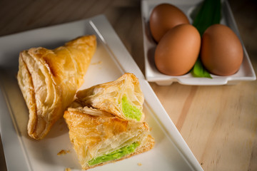 Crispy Pandan or Kaya pie, homemade bakery on wooden background, selective focus