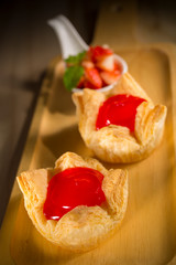 Strawberry jam pie, fresh homemade bakery on wooden background, selective focus