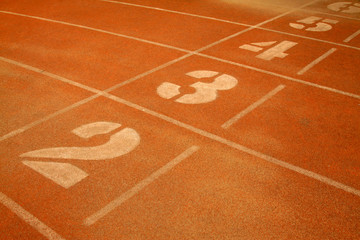 green number on plastic runway in a sports ground