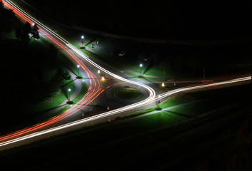 Long exposure car lights on roundabout below Arthur's Seat, Edinburgh, Scotland