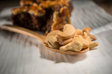 Cashews nut with toffee cake, Homemade bakery on white blackground, copy space, selective focus