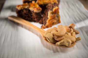 Cashews nut with toffee cake, Homemade bakery on white blackground, copy space, selective focus