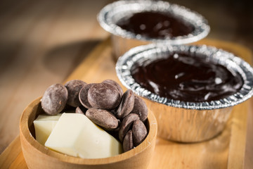 Chocolate Fudge Cupcake with butter and chocolate chip, Homemade bakery pastry on wooden background, selective focus