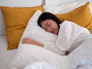 young beautiful girl sleeping in bedroom