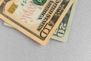 ten and twenty dollars on grey background. paper money. USA banknotes