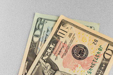 ten and twenty dollars on grey background. paper money. USA banknotes