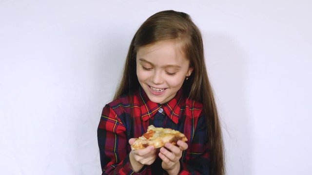 A little girl holds a box of pizza and wants to open it
