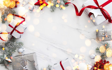 Christmas and New Year holiday background. Xmas greeting card. Christmas gifts on white marble background top view. Flat lay