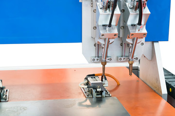soldering iron tips of robotic system for automatic point soldering for printed and assembly electric circuit board ( PCB ) at factory