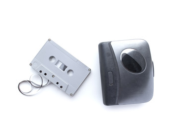 Old cassette player and cassette tape isolated on white background