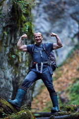Fototapeta premium Tourist hiking in a canyon